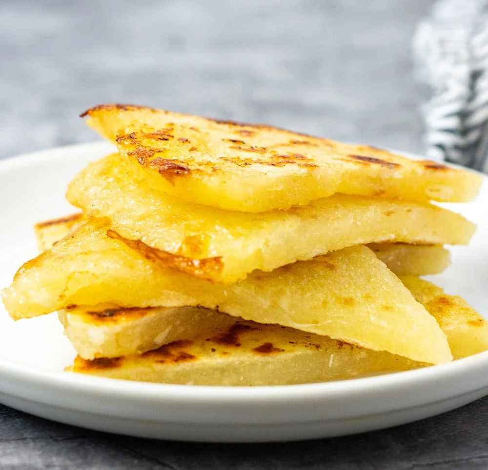 Bammy, a traditional cassava flatbread, often accompanies this dish, CARIBBEAN BREAKFAST DISHES